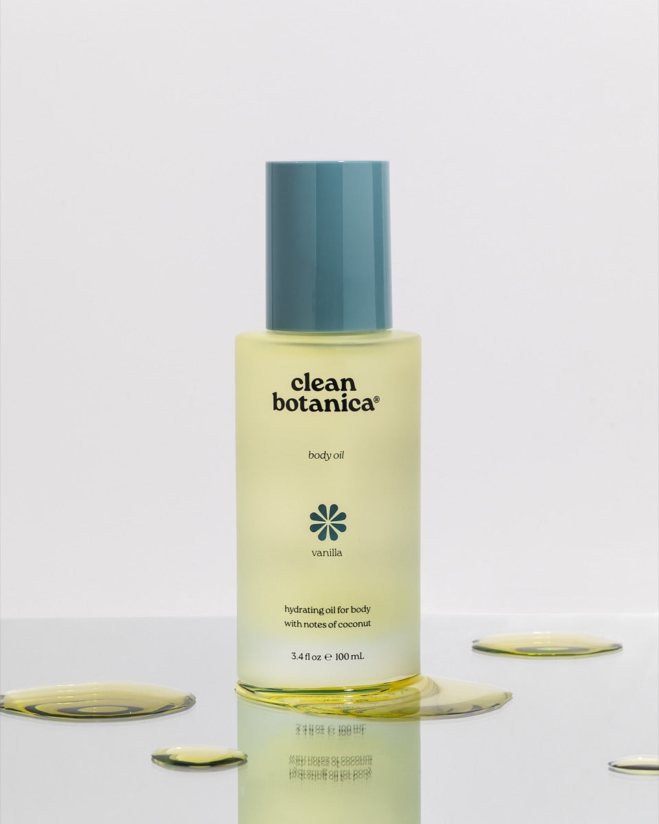 Clean Botanica body oil reflected on a glossy surface
