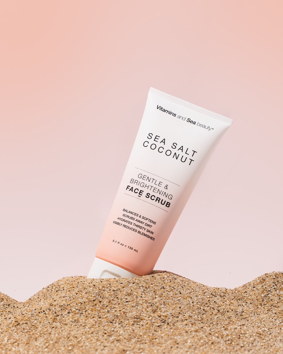 Vitamins and Sea beauty Sea Salt Coconut face scrub standing in sand